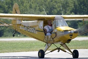 Stan Segalla with his classic yellow Piper always entertains the air show crowd.His 